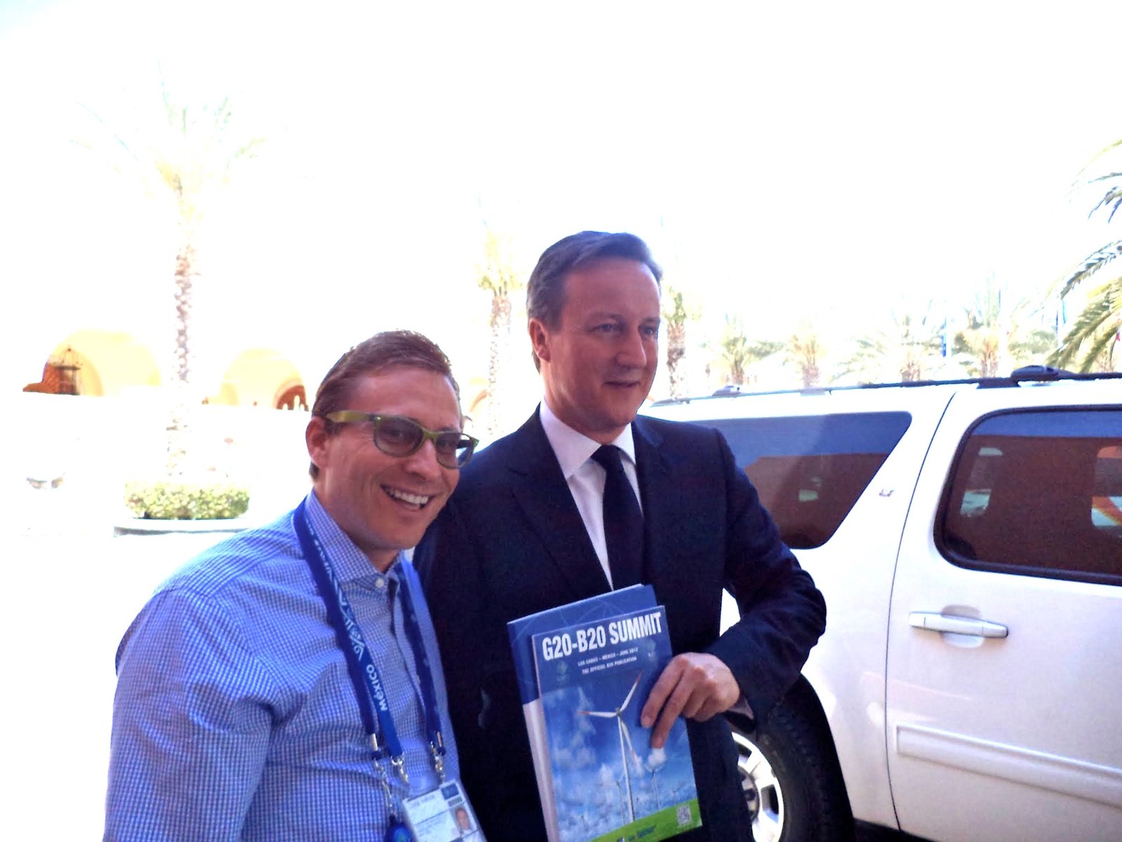 Group of Nations President Chris Atkins with UK Prime Minister David Cameron, who holds the G20-B20 Summit publication, Los Cabos, Mexico, 2012