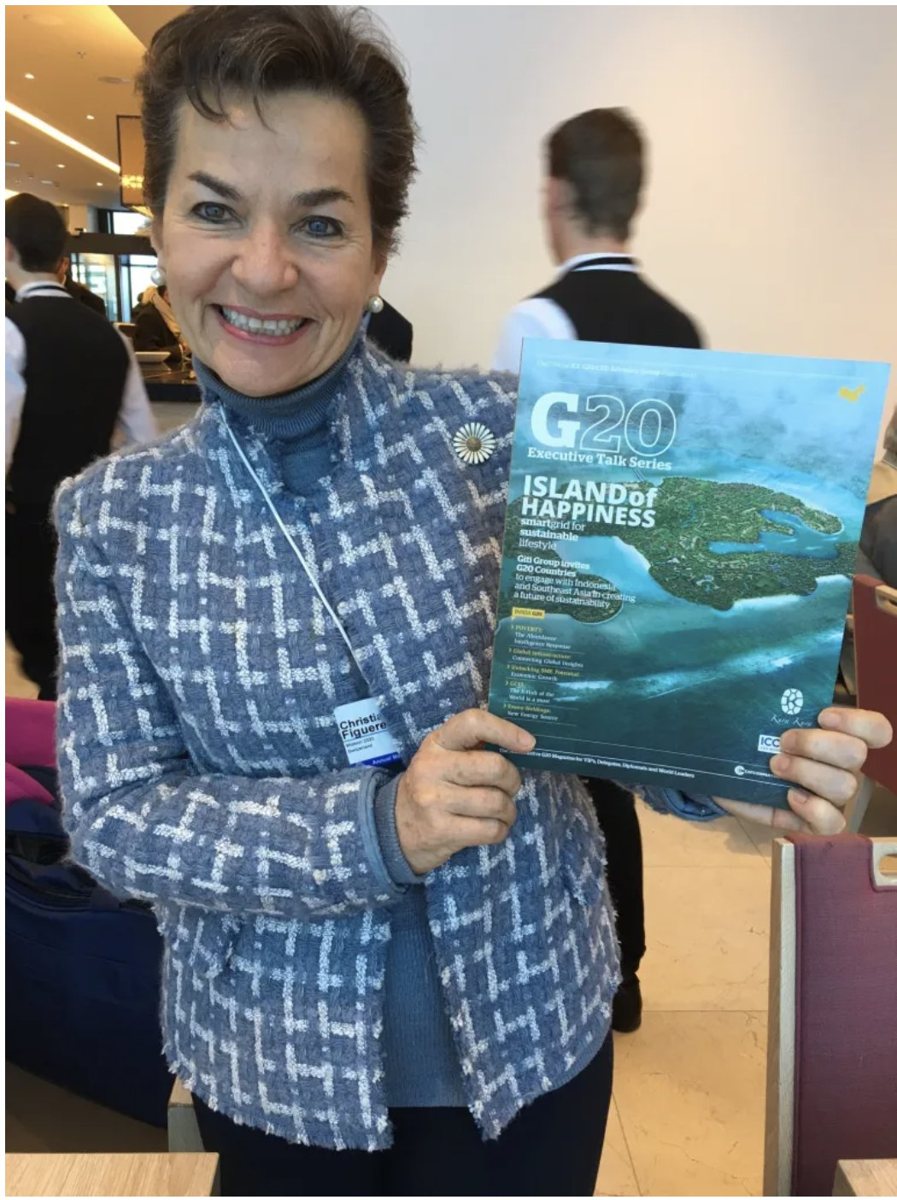 Christiana Figueres holding a Group of Nations G20 edition