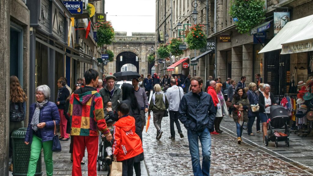 Visitors exploring a busy city street