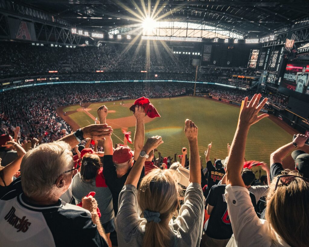 Fans cheering in a packed stadium